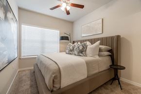 Springdale apartment for rent - a bedroom with a bed and a ceiling fan