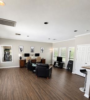 Midland apartment for rent - A living room with a couch, chairs, and a television.