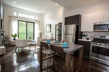 Weymouth apartment for rent - A modern kitchen with a dining table and chairs.