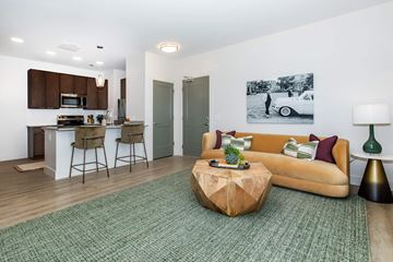 Huber Heights apartment for rent - A living room with a couch, a coffee table, and a painting on the wall.