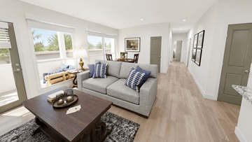 Huber Heights apartment for rent - A modern living room with a grey sofa and a wooden coffee table.