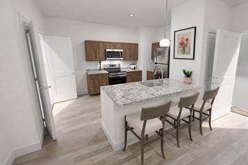 Huber Heights apartment for rent - A kitchen with a marble countertop and wooden cabinets.