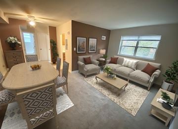 Rockville apartment for rent - A living room with a dining table and chairs.