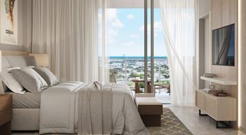Hollywood apartment for rent - A bedroom with a large bed and a view of the city.