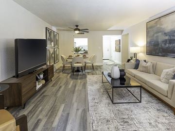 Salt Lake City apartment for rent - A living room with a grey carpet and a black coffee table.