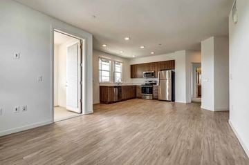 Livermore apartment for rent - A kitchen with a refrigerator, stove, and sink is shown.