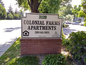 Modesto apartment for rent - Colonial Farms Apartments - address sign with phone number 209-545-3925 and TTY 711