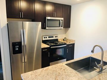 Carson City apartment for rent - a kitchen with stainless steel appliances and a sink