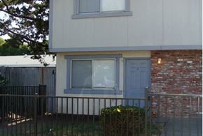 Santa Rosa apartment for rent - a house with a blue door and a red brick wall