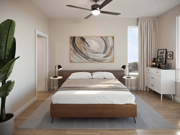 Reno apartment for rent - A modern bedroom with a large bed and a painting on the wall.