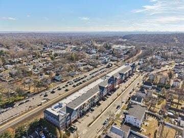 Waldwick apartment for rent - A train station in a residential area with a train on the tracks.