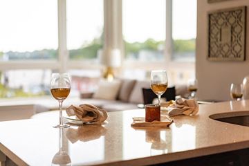 South Orange apartment for rent - A kitchen counter with two glasses of wine and a lit candle.