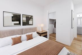 Camarillo townhouse for rent - A bedroom with a large bed and two abstract paintings on the wall at The Villas at Anacapa Canyon, Camarillo, 93012