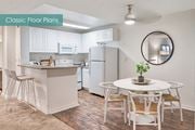 Culver City apartment for rent - A kitchen with a white table and chairs at The Meadows Apartments, Culver City , CA 90230