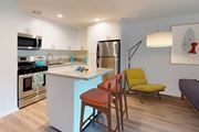 Los Angeles apartment for rent - A kitchen with a blue island and a yellow chair at Rancho Los Feliz, Los Angeles, California