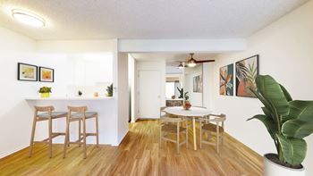 An open dining room and kitchen with a table and chairs