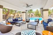 Victorville apartment for rent - A patio with a pool and furniture at Mountain Vista, Victorville, CA
