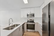 Marina Del Rey apartment for rent - A modern kitchen with stainless steel appliances and white cabinetry.