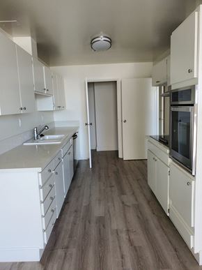 Long Beach apartment for rent - Kitchen with White Appliances and White Cabinets