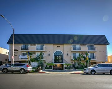 Los Angeles apartment for rent - a large building with cars parked in front of it