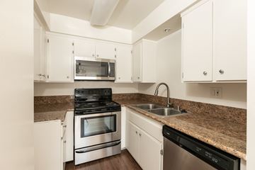 Los Angeles apartment for rent - the preserve at ballantyne commons apartment kitchen with granite counter tops and stainless appliances