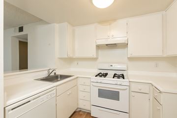 Los Angeles apartment for rent - an empty kitchen with white appliances and white cabinets