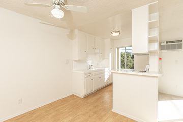 Los Angeles apartment for rent - a kitchen with white cabinets and a white counter top