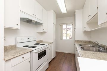 Los Angeles apartment for rent - a kitchen with white appliances and white cabinets