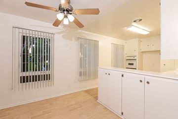 Los Angeles apartment for rent - the living room and kitchen of an apartment with a ceiling fan