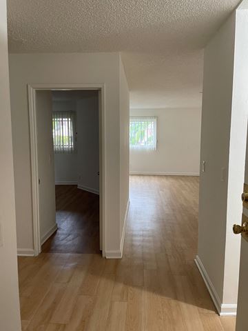 Los Angeles apartment for rent - an open living room and dining room with hardwood floors