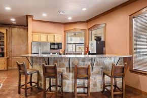 Austin apartment for rent - a kitchen with a bar and chairs at The Verandah, Texas