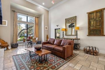 Austin apartment for rent - a living room with a leather couch and a rug