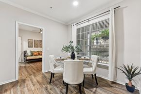Austin apartment for rent - A dining room with a table set for two and a potted plant. at Stone Oak @ Parmer, Texas, 78727