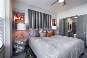 Hutto apartment for rent - a bedroom with a large bed and a mirror at North Creek, Hutto, 78634