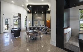 Hutto apartment for rent - a dining room with tables and chairs and a bar in the corner at North Creek, Hutto, Texas