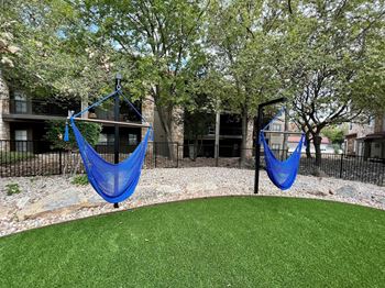 Community cornhole and hammock area