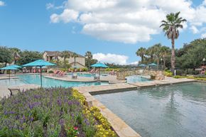 Austin apartment for rent - a swimming pool with umbrellas at the resort at The Verandah, Austin