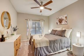 Austin townhouse for rent - Primary bedroom with dresser at Artisan Apartments & Shops, Austin, TX