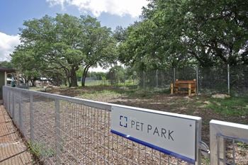 A fence with a sign that reads c pet park
