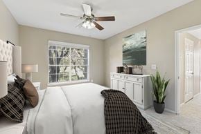 San Antonio apartment for rent - a bedroom with a large bed and a ceiling fan at Legends on the Green Apartments, Texas