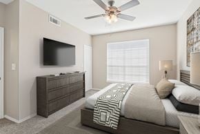 San Antonio apartment for rent - a bedroom with a large bed and a ceiling fan at TalaVera Apartments, Texas, 78232