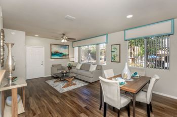 A living room and dining room with a couch and a table