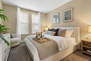 Ocoee apartment for rent - A bedroom with a large bed and a chair  at The Oasis at Lake Bennet, Ocoee, FL, 34761