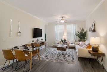 Jacksonville apartment for rent - an open living room and dining room with a couch and a table