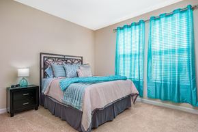 Orlando apartment for rent - Bedroom with cozy bed with curtains at The Oasis at Crosstown, Orlando