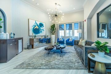 Goodyear apartment for rent - a living room with a couch and a chandelier