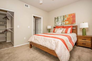 A bedroom with a bed and a closet