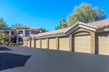 A row of garage doors in front of a house