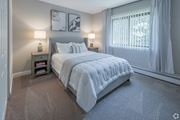 Warwick apartment for rent - A bedroom with a large bed and two lamps.
