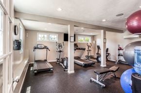 Middletown apartment for rent - A spacious home gym with a variety of exercise equipment.